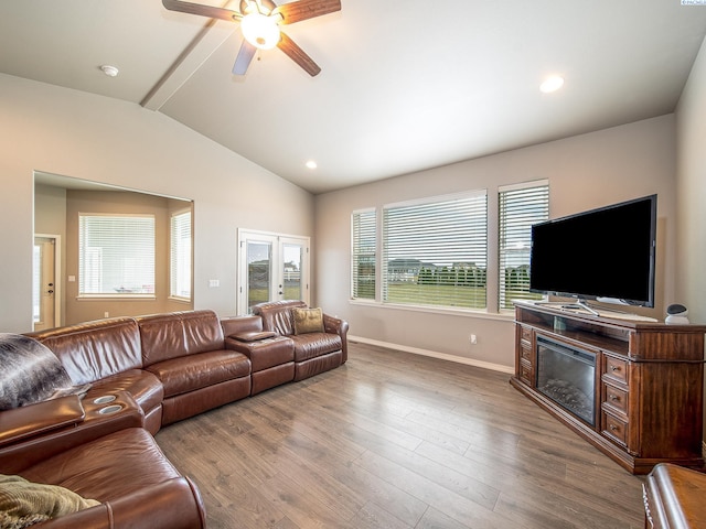 living room featuring lofted ceiling with beams, recessed lighting, wood finished floors, a ceiling fan, and baseboards