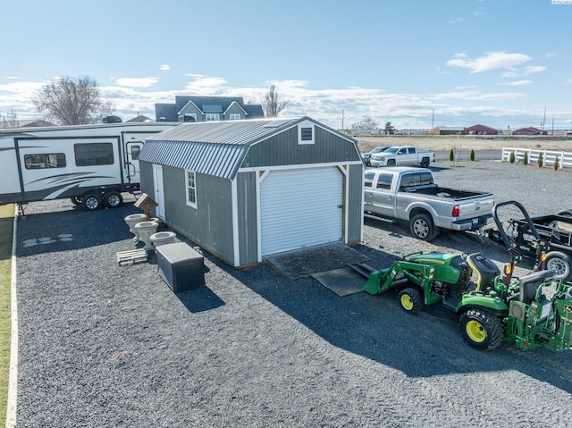 detached garage featuring driveway