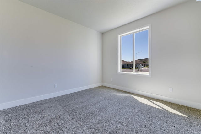 1557 Livorno Ave, Richland, WA 99352 - spare room featuring baseboards and carpet