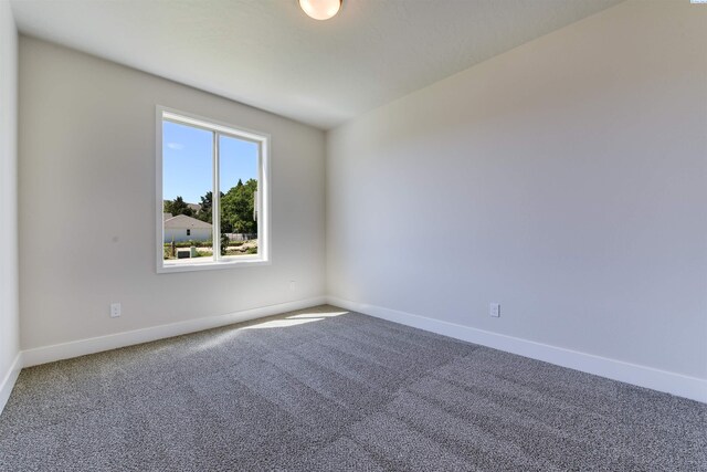 1557 Livorno Ave, Richland, WA 99352 - spare room with baseboards and carpet floors