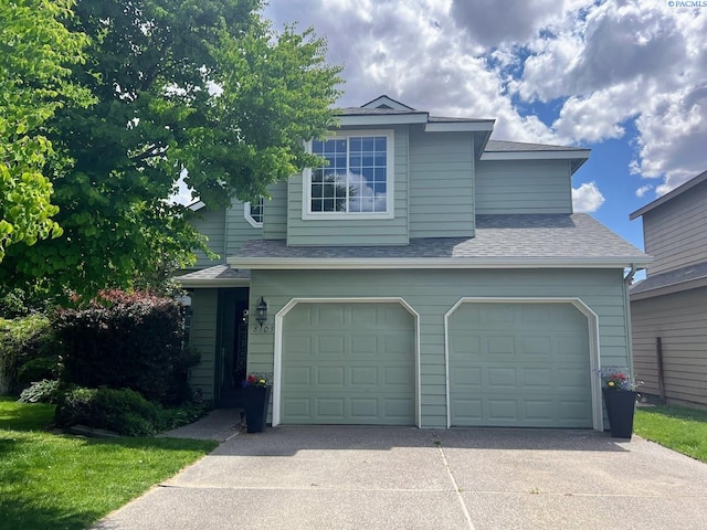 8103 W Bruneau Ave, Kennewick, WA 99336 - view of front facade featuring a garage, driveway, and a shingled roof