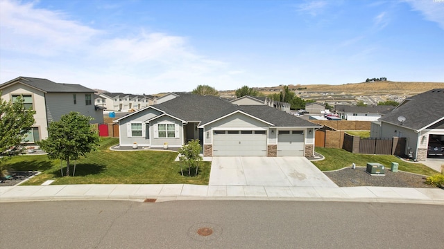 6564 W 38th Ave, Kennewick, WA 99338 - view of front of property with a residential view, an attached garage, and driveway