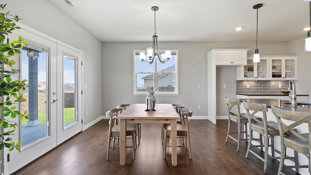 6564 W 38th Ave, Kennewick, WA 99338 - dining room featuring healthy amount of natural light, a chandelier, dark wood-type flooring, and recessed lighting