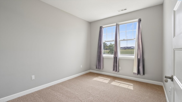 6564 W 38th Ave, Kennewick, WA 99338 - spare room with light carpet and baseboards