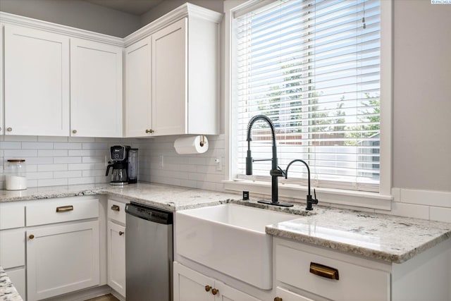 10389 W 17th Pl, Kennewick, WA 99338 - kitchen featuring stainless steel dishwasher, white cabinetry, and plenty of natural light