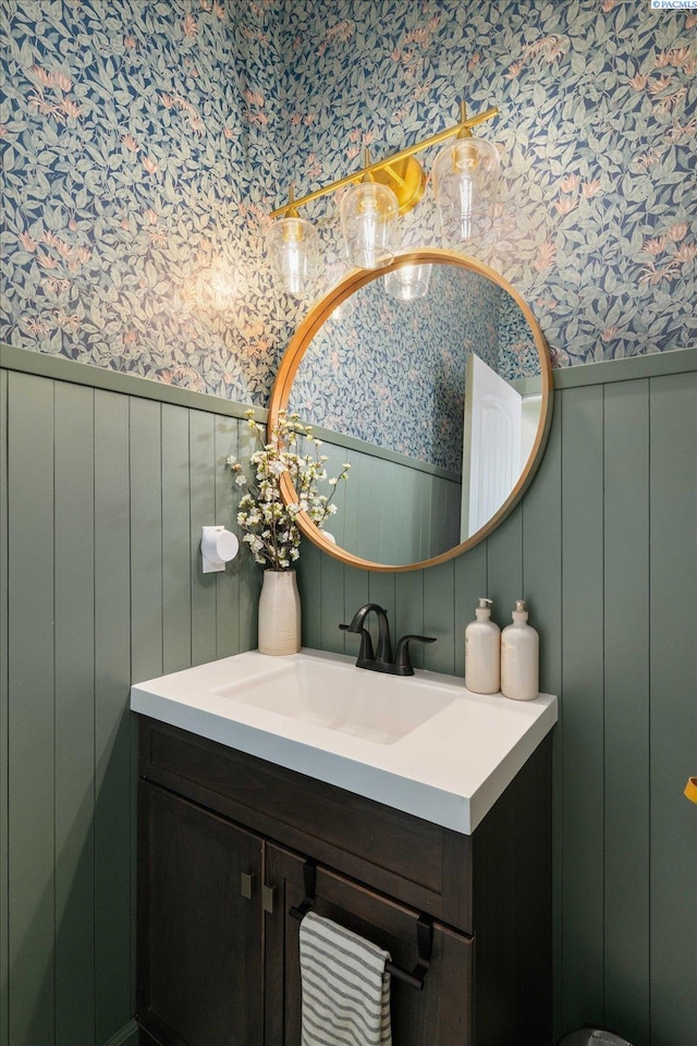 10389 W 17th Pl, Kennewick, WA 99338 - bathroom with wallpapered walls, wainscoting, vanity, and a decorative wall