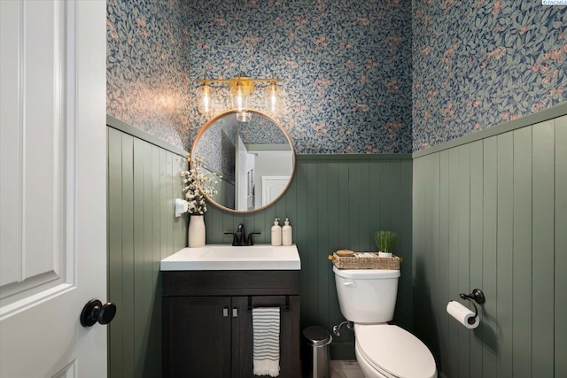 10389 W 17th Pl, Kennewick, WA 99338 - half bath featuring wallpapered walls, vanity, and a wainscoted wall