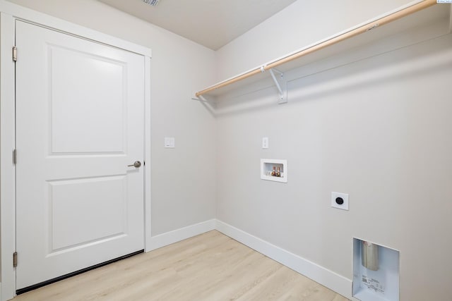 clothes washing area with washer hookup, light wood-type flooring, and electric dryer hookup