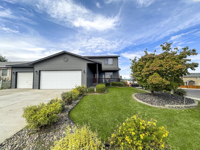 view of front facade with a garage and a front yard