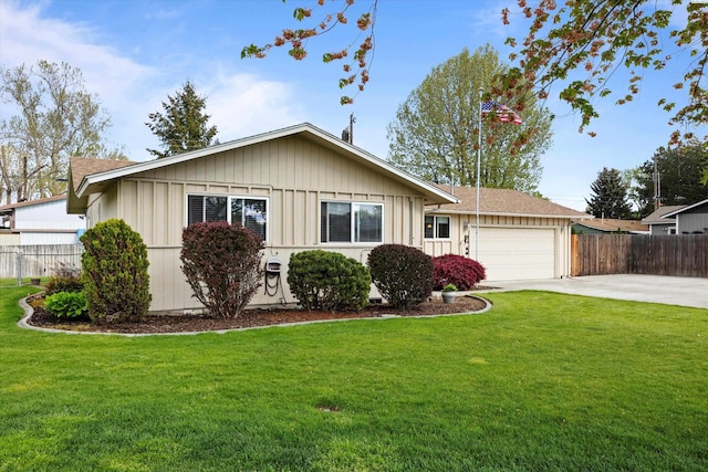ranch-style house with board and batten siding, an attached garage, driveway, and fence