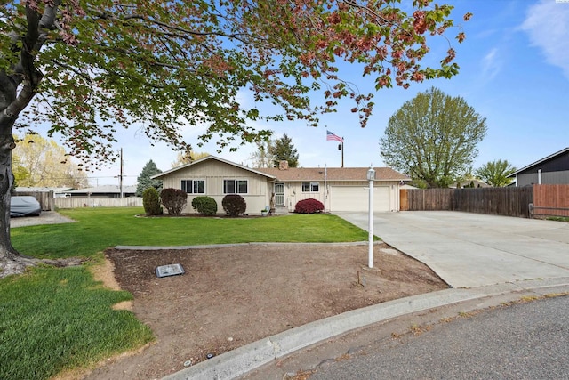 single story home featuring driveway, fence, a front yard, and a garage