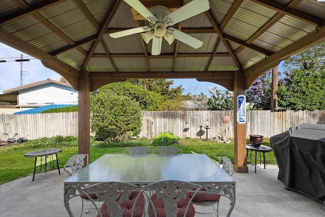 view of patio / terrace with outdoor dining area, a gazebo, and a fenced backyard