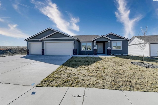 6905 Rd 108, Pasco, WA 99301 - ranch-style house featuring an attached garage, driveway, stucco siding, and stone siding