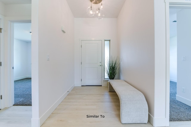 6905 Rd 108, Pasco, WA 99301 - entrance foyer featuring a chandelier, light wood-type flooring, and baseboards