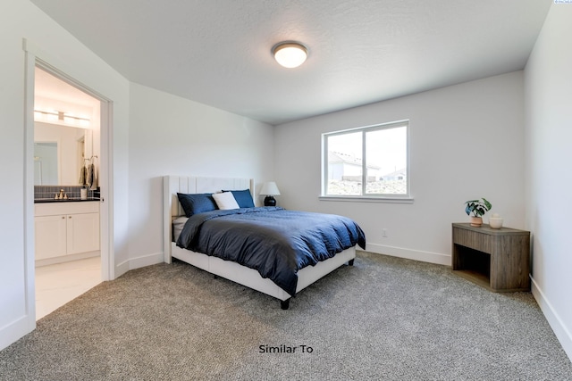 6905 Rd 108, Pasco, WA 99301 - carpeted bedroom featuring ensuite bath and baseboards