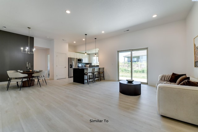 6905 Rd 108, Pasco, WA 99301 - living room featuring light wood finished floors, recessed lighting, a chandelier, and baseboards