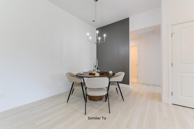 6905 Rd 108, Pasco, WA 99301 - dining area with a chandelier, light wood-type flooring, and baseboards
