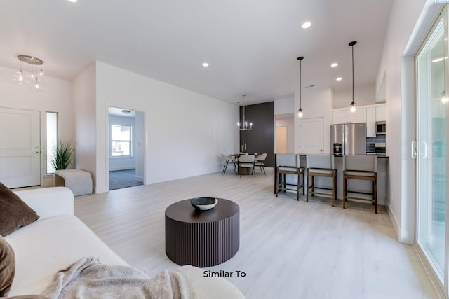 6905 Rd 108, Pasco, WA 99301 - living area featuring a chandelier, light wood finished floors, and recessed lighting