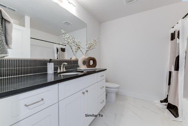 6905 Rd 108, Pasco, WA 99301 - bathroom with vanity, toilet, a shower with shower curtain, and marble finish floors