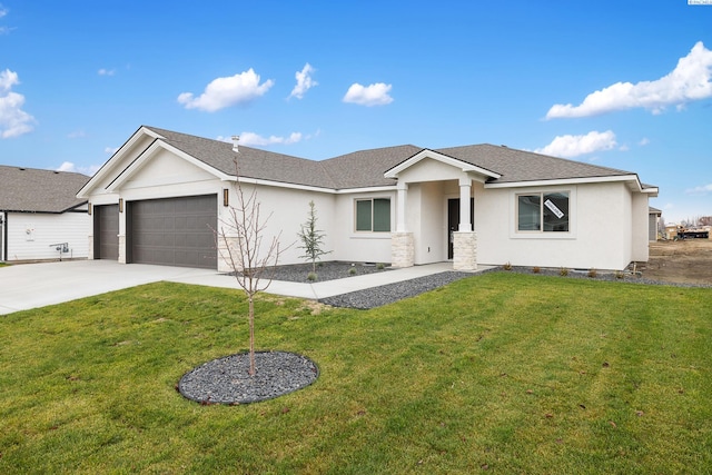 10409 Kokanee Dr, Pasco, WA 99301 - ranch-style house featuring stucco siding, a garage, concrete driveway, a front lawn, and roof with shingles