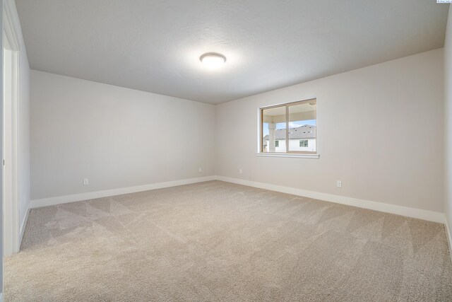 10409 Kokanee Dr, Pasco, WA 99301 - carpeted empty room featuring baseboards