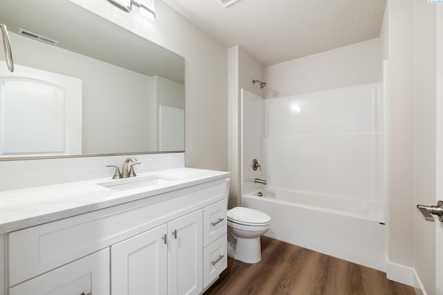 10409 Kokanee Dr, Pasco, WA 99301 - bathroom with vanity, wood finished floors, and shower / washtub combination