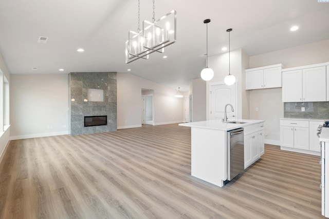 10409 Kokanee Dr, Pasco, WA 99301 - kitchen featuring dishwasher, recessed lighting, open floor plan, light wood-type flooring, and decorative backsplash