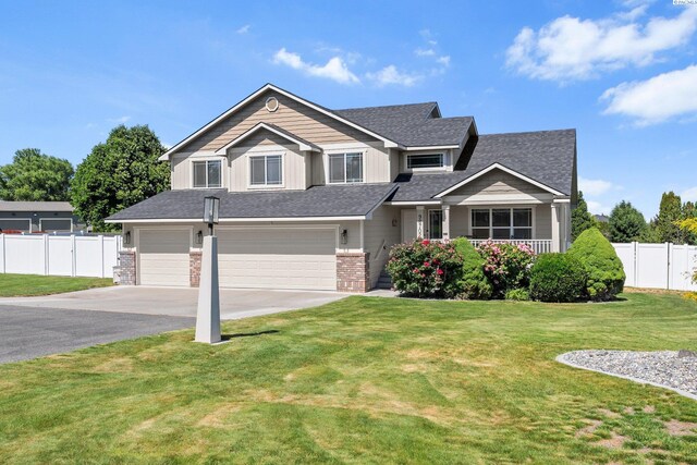 98702 E Brooklyn Dr, Kennewick, WA 99338 - view of front of property featuring driveway, a garage, and roof with shingles