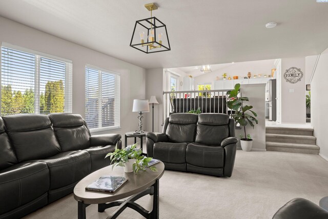 98702 E Brooklyn Dr, Kennewick, WA 99338 - living area featuring light carpet and a chandelier