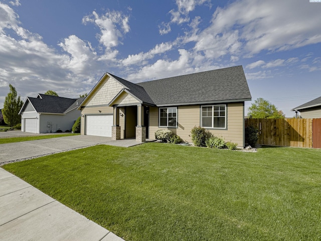 ranch-style house featuring concrete driveway, a front lawn, fence, a garage, and roof with shingles