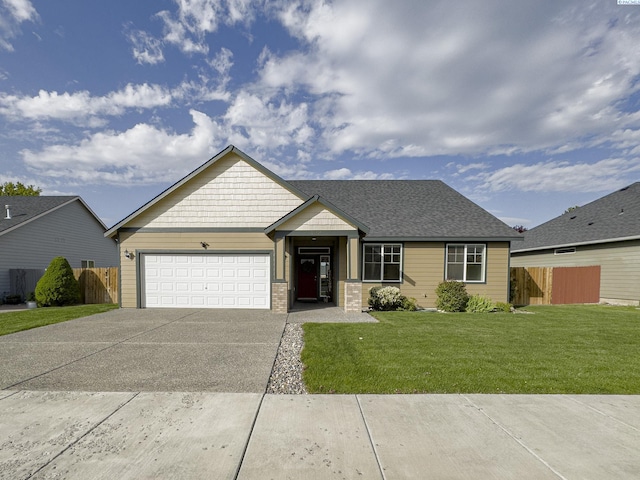 view of front of property with a garage, driveway, a front yard, and fence