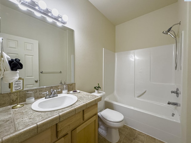 bathroom featuring toilet, vanity, and bathing tub / shower combination