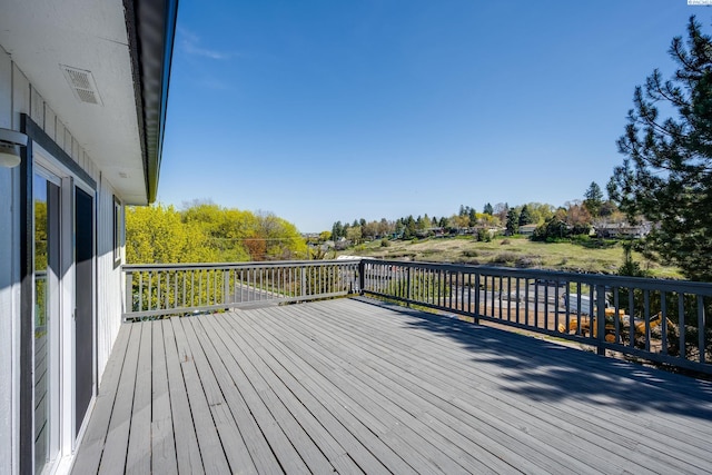 wooden deck with visible vents