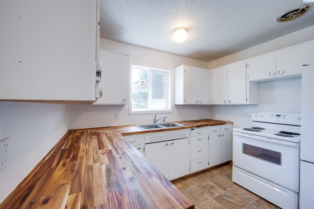 kitchen with a sink, a textured ceiling, butcher block countertops, visible vents, and white electric range