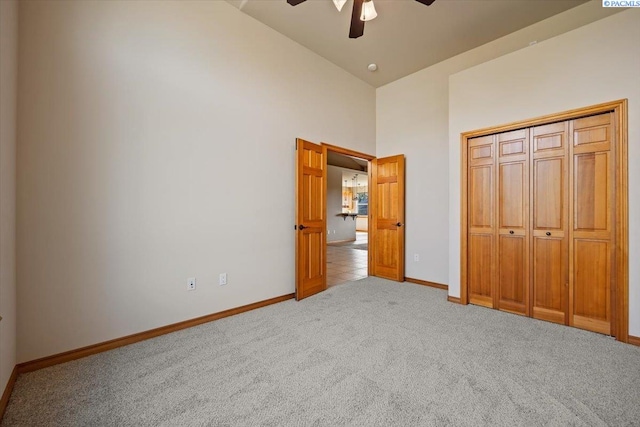 100 S Nevada St, Kennewick, WA 99336 - unfurnished bedroom featuring high vaulted ceiling, light colored carpet, a ceiling fan, and a closet