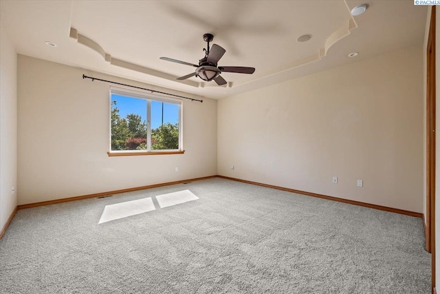 100 S Nevada St, Kennewick, WA 99336 - carpeted empty room featuring a tray ceiling and ceiling fan