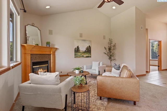 100 S Nevada St, Kennewick, WA 99336 - living room featuring ceiling fan, a glass covered fireplace, high vaulted ceiling, recessed lighting, and light tile patterned floors