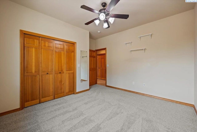100 S Nevada St, Kennewick, WA 99336 - unfurnished bedroom featuring light carpet, ceiling fan, and a closet