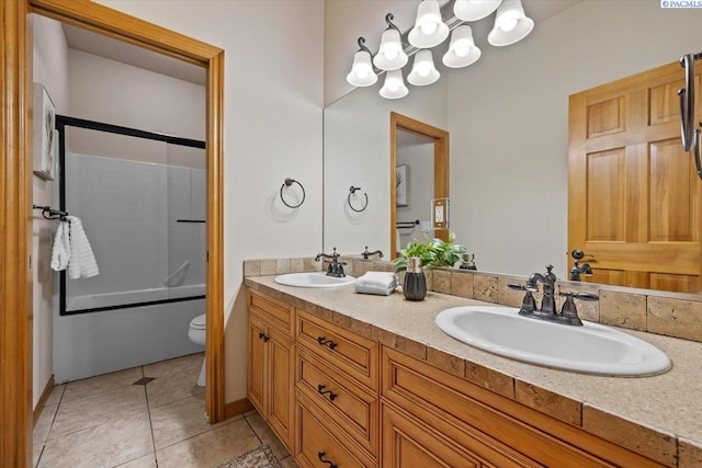 100 S Nevada St, Kennewick, WA 99336 - bathroom featuring double vanity, enclosed tub / shower combo, tile patterned flooring, and a chandelier