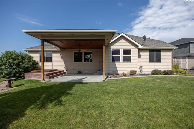 100 S Nevada St, Kennewick, WA 99336 - back of property featuring ceiling fan, a patio, and a lawn