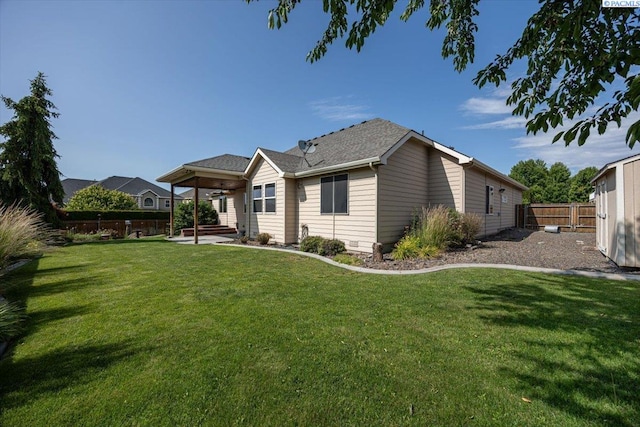 100 S Nevada St, Kennewick, WA 99336 - rear view of house featuring a patio area, a fenced backyard, and a ceiling fan