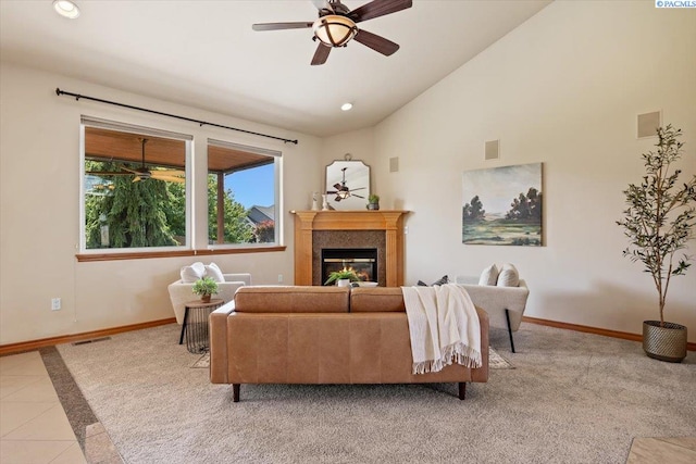 100 S Nevada St, Kennewick, WA 99336 - living area with a ceiling fan, a glass covered fireplace, recessed lighting, light carpet, and high vaulted ceiling
