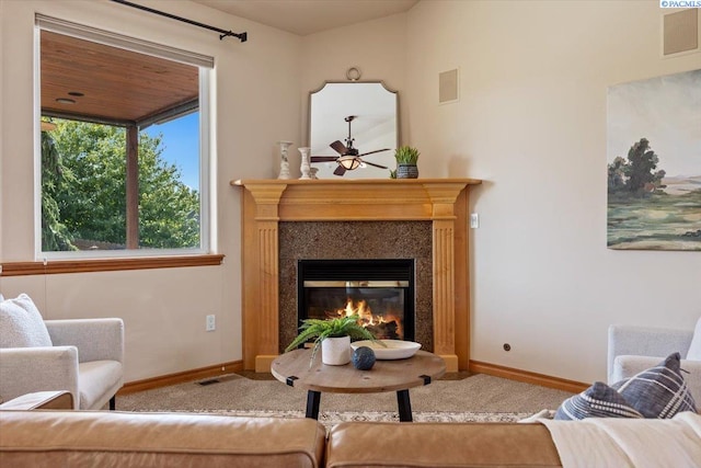 100 S Nevada St, Kennewick, WA 99336 - carpeted living room featuring a glass covered fireplace and a ceiling fan