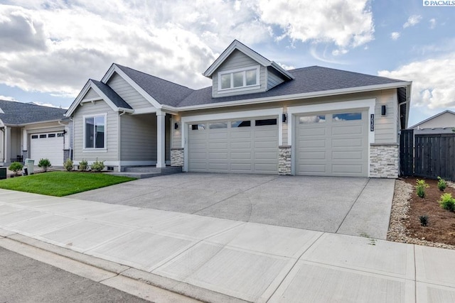 view of front of property with a garage and a front yard