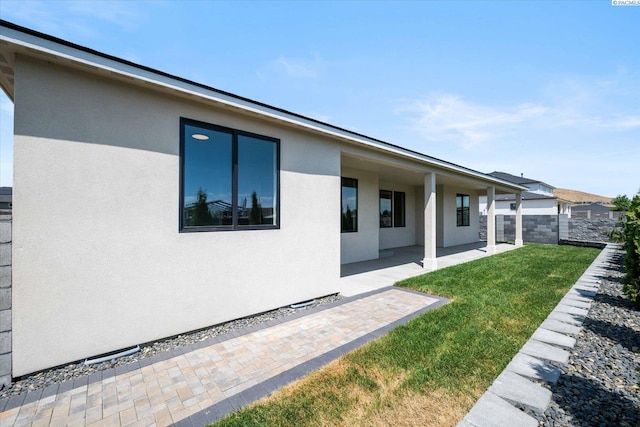 671 Cortona Way, Richland, WA 99352 - rear view of property featuring a patio and stucco siding