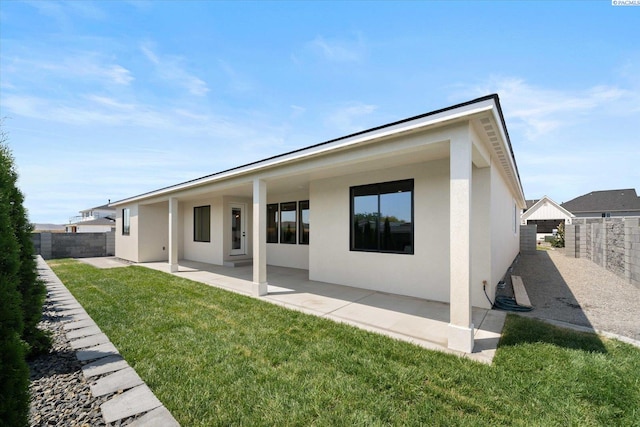 671 Cortona Way, Richland, WA 99352 - rear view of property featuring stucco siding, a patio area, and a fenced backyard