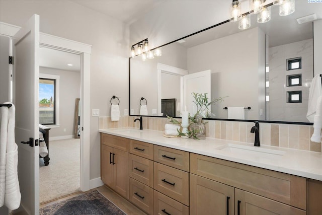 671 Cortona Way, Richland, WA 99352 - ensuite bathroom with double vanity and baseboards