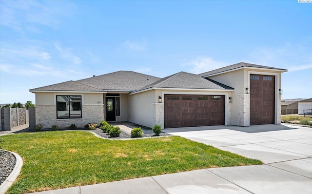 671 Cortona Way, Richland, WA 99352 - view of front of house featuring a garage, stucco siding, stone siding, and concrete driveway