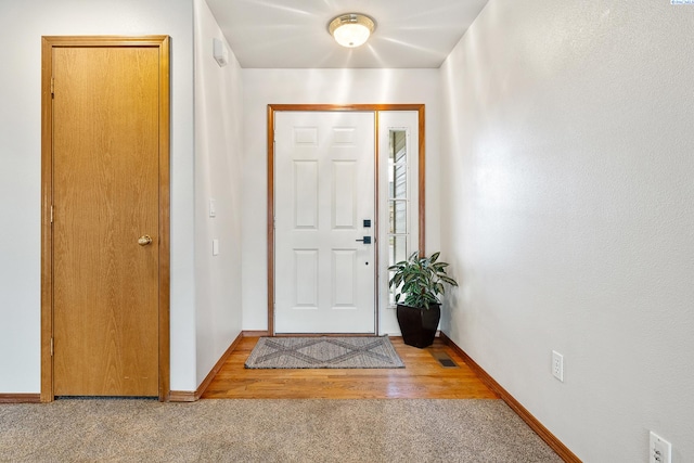 view of carpeted foyer