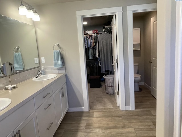230 Ladera St, Prosser, WA 99350 - full bath featuring toilet, wood finished floors, a sink, and baseboards